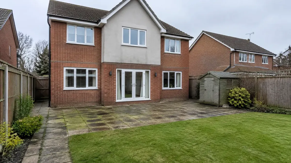 Before: grimy, moss-stained patio slabs behind a red-brick Essex family home and fenced lawn